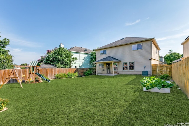 11747 Silver Pr, San Antonio, TX 78254 - rear view of property featuring a fenced backyard, a playground, and a patio