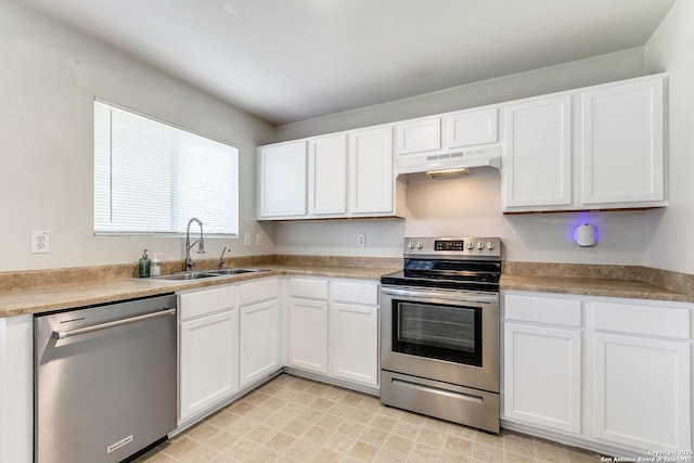 11747 Silver Pr, San Antonio, TX 78254 - kitchen with appliances with stainless steel finishes, under cabinet range hood, and white cabinetry