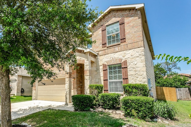 27338 Wrought Iron, San Antonio, TX 78260 - view of front of property featuring stone siding, concrete driveway, and an attached garage