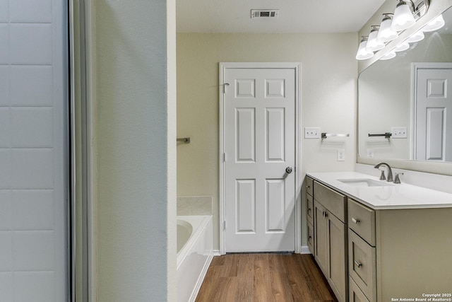 27338 Wrought Iron, San Antonio, TX 78260 - bathroom with wood finished floors, vanity, and a bath
