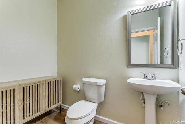 27338 Wrought Iron, San Antonio, TX 78260 - half bathroom featuring wood finished floors and radiator