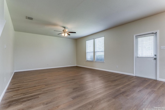 27338 Wrought Iron, San Antonio, TX 78260 - unfurnished room featuring a ceiling fan and dark wood-type flooring