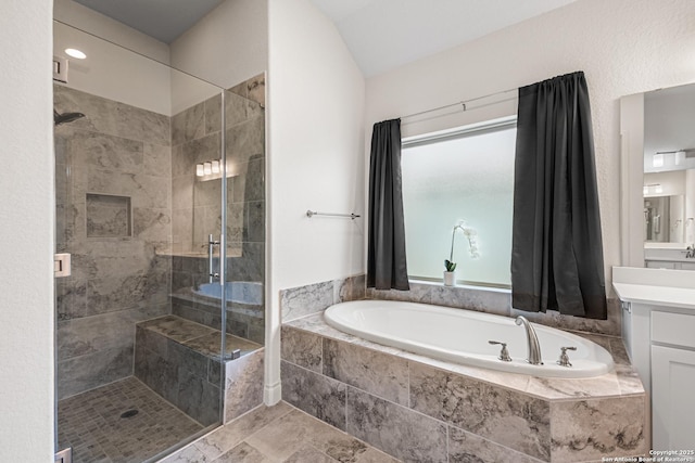130 Boulder Crk, Boerne, TX 78006 - full bathroom featuring vanity, a garden tub, and a shower stall