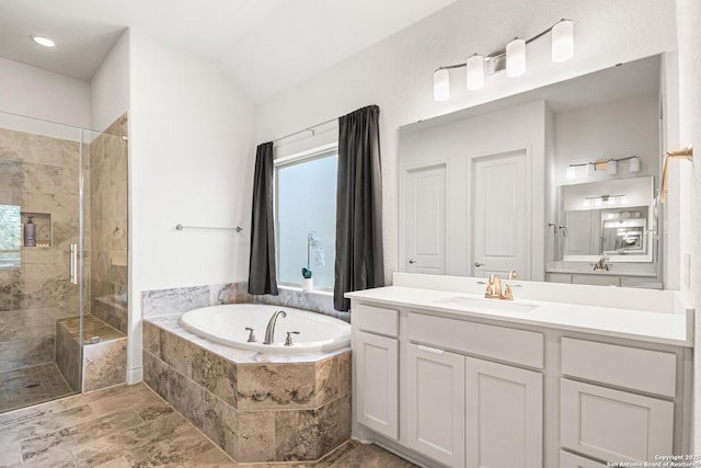 130 Boulder Crk, Boerne, TX 78006 - bathroom featuring a bath, a shower stall, vanity, and vaulted ceiling