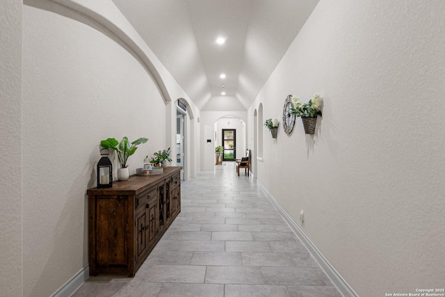 130 Boulder Crk, Boerne, TX 78006 - corridor with vaulted ceiling, recessed lighting, arched walkways, and light tile patterned flooring