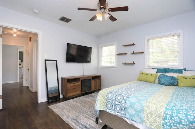 621 Hackberry, Seguin, TX 78155 - bedroom featuring dark wood-style flooring and ceiling fan