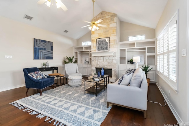 1407 Canyon Edge, San Antonio, TX 78248 - living area featuring a ceiling fan, a stone fireplace, wood finished floors, and high vaulted ceiling