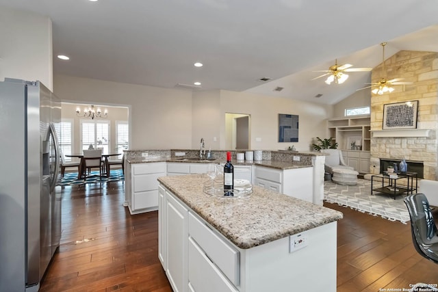 1407 Canyon Edge, San Antonio, TX 78248 - kitchen with stainless steel refrigerator with ice dispenser, a center island, ceiling fan, dark wood-style floors, and vaulted ceiling