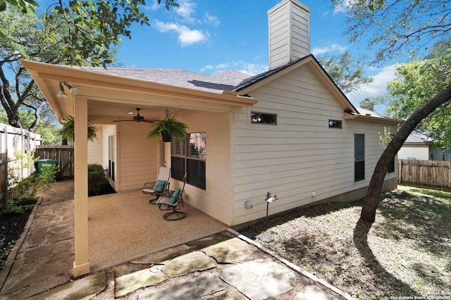 1407 Canyon Edge, San Antonio, TX 78248 - back of property featuring a patio, a ceiling fan, a chimney, and a shingled roof