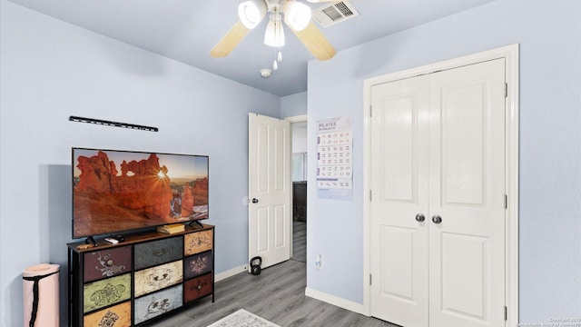 1238 Sugar Land, New Braunfels, TX 78130 - bedroom featuring wood finished floors, a closet, and a ceiling fan