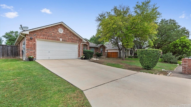 1238 Sugar Land, New Braunfels, TX 78130 - view of front facade featuring a garage, brick siding, and concrete driveway