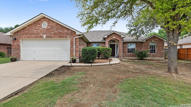 1238 Sugar Land, New Braunfels, TX 78130 - view of front facade with brick siding, a garage, driveway, and a shingled roof