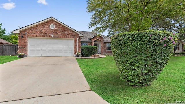 1238 Sugar Land, New Braunfels, TX 78130 - view of front facade featuring a garage, concrete driveway, and brick siding