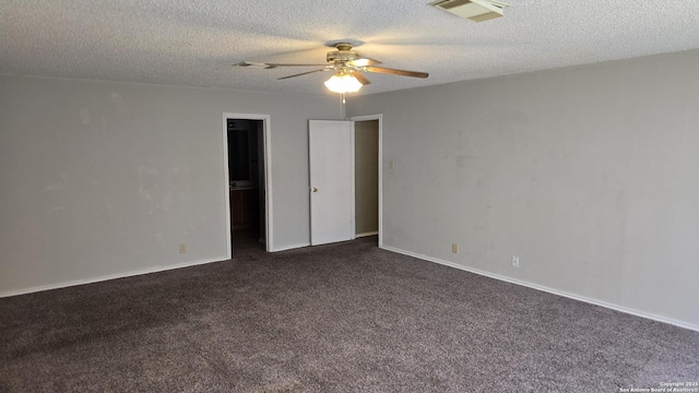 8310 Border Rdg, San Antonio, TX 78240 - spare room with a ceiling fan, dark carpet, and a textured ceiling