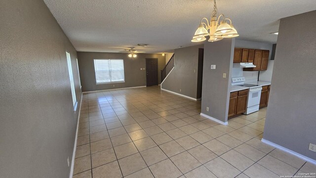 8310 Border Rdg, San Antonio, TX 78240 - unfurnished room featuring a chandelier, stairway, light tile patterned floors, a textured ceiling, and ceiling fan