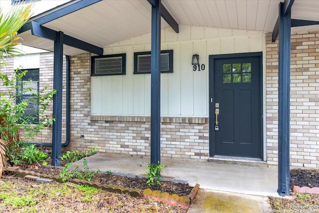 910 Mount Kisco, San Antonio, TX 78213 - entrance to property featuring brick siding, a porch, and board and batten siding