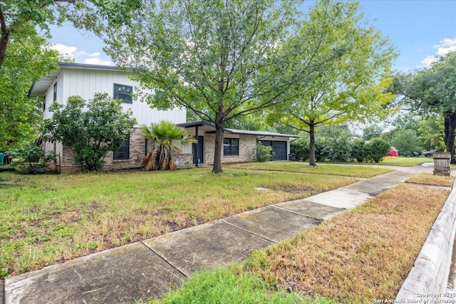 910 Mount Kisco, San Antonio, TX 78213 - view of front of house with a front yard, brick siding, and an attached garage