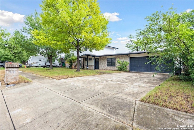 910 Mount Kisco, San Antonio, TX 78213 - mid-century inspired home with an attached garage, concrete driveway, a front lawn, and brick siding