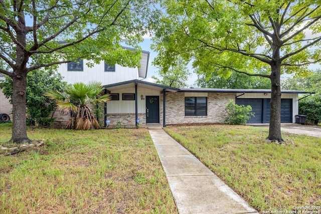 910 Mount Kisco, San Antonio, TX 78213 - view of front facade featuring brick siding, an attached garage, driveway, and a front lawn