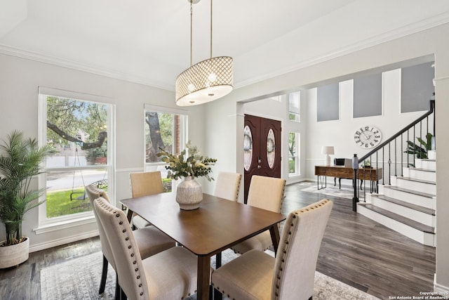 4130 Luckenbach, San Antonio, TX 78251 - dining room featuring healthy amount of natural light, crown molding, stairs, and wood finished floors