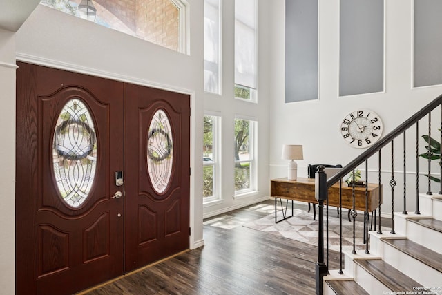 4130 Luckenbach, San Antonio, TX 78251 - foyer entrance with stairs, a towering ceiling, and wood finished floors