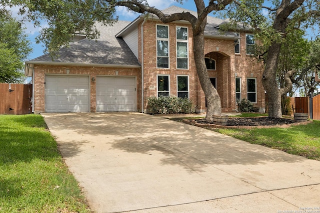 4130 Luckenbach, San Antonio, TX 78251 - traditional-style home with brick siding, a garage, roof with shingles, and concrete driveway