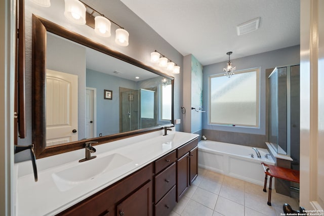 1573 Las Fontanasa, New Braunfels, TX 78132 - bathroom featuring tile patterned flooring, a shower stall, double vanity, a bath, and a chandelier
