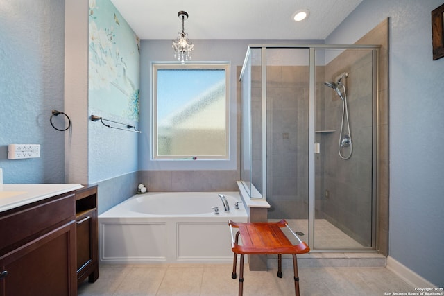1573 Las Fontanasa, New Braunfels, TX 78132 - bathroom with a bath, a shower stall, vanity, and tile patterned floors