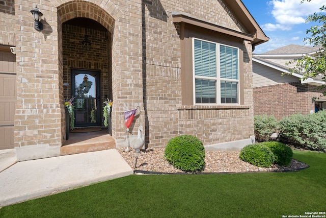1573 Las Fontanasa, New Braunfels, TX 78132 - view of exterior entry featuring brick siding