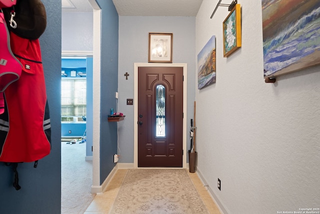 1573 Las Fontanasa, New Braunfels, TX 78132 - foyer entrance featuring a textured wall and tile patterned floors