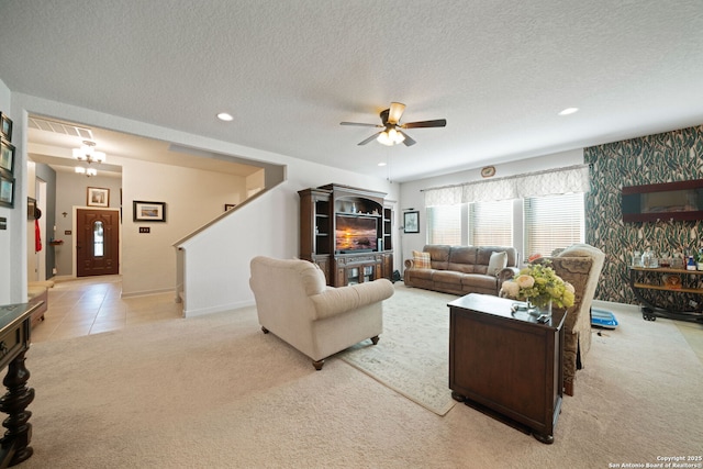 1573 Las Fontanasa, New Braunfels, TX 78132 - living area with a ceiling fan, carpet flooring, a textured ceiling, stairs, and recessed lighting