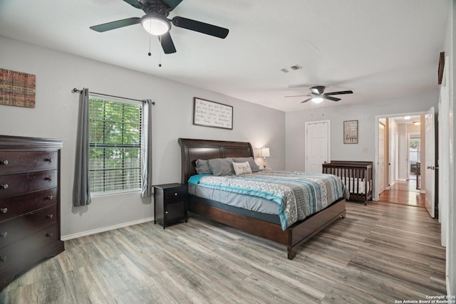 714 N Esplanade, Karnes City, TX 78118 - bedroom featuring light wood-style floors and ceiling fan