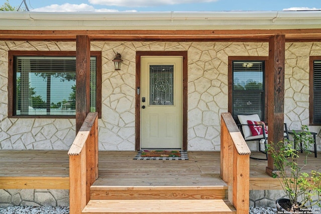 714 N Esplanade, Karnes City, TX 78118 - view of exterior entry featuring stone siding and a porch