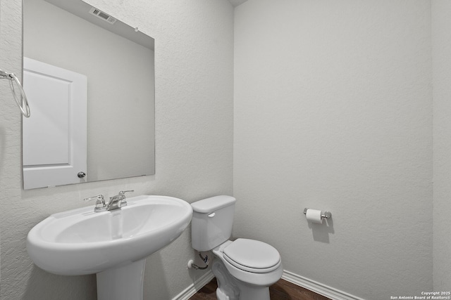 14034 Breccia, San Antonio, TX 78253 - half bathroom featuring toilet and wood finished floors