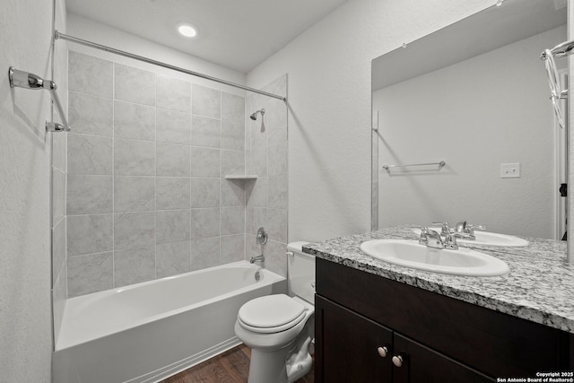 14034 Breccia, San Antonio, TX 78253 - full bathroom with vanity, wood finished floors, and shower / bathtub combination