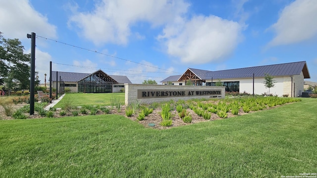 14034 Breccia, San Antonio, TX 78253 - rear view of property featuring a lawn and a metal roof