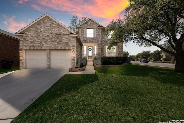 21731 Cliff Vw, San Antonio, TX 78259 - traditional-style home with a garage, concrete driveway, a front yard, and brick siding