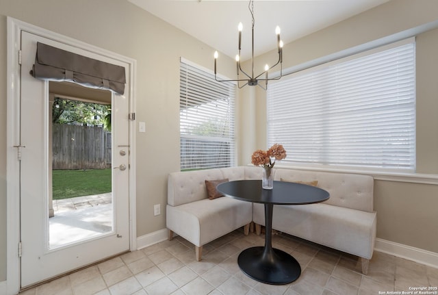 21731 Cliff Vw, San Antonio, TX 78259 - tiled dining area with breakfast area and a chandelier