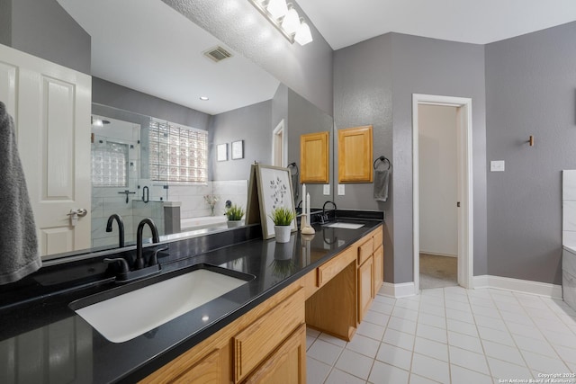 21731 Cliff Vw, San Antonio, TX 78259 - bathroom with double vanity, a stall shower, a garden tub, and tile patterned floors