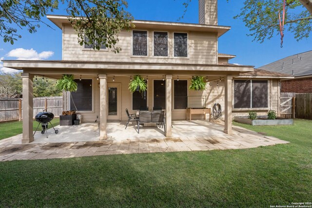 21731 Cliff Vw, San Antonio, TX 78259 - rear view of house featuring a patio area, a chimney, and a fenced backyard
