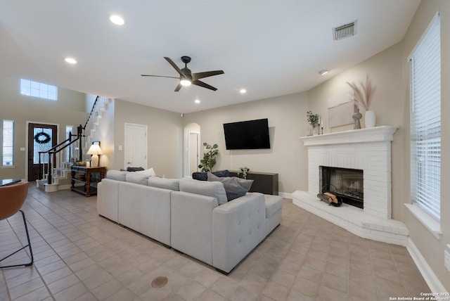 21731 Cliff Vw, San Antonio, TX 78259 - living room featuring stairs, healthy amount of natural light, ceiling fan, arched walkways, and recessed lighting