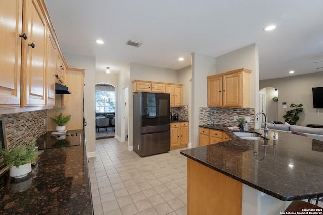 21731 Cliff Vw, San Antonio, TX 78259 - kitchen featuring smart refrigerator, arched walkways, black electric cooktop, light brown cabinetry, and recessed lighting