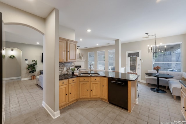 21731 Cliff Vw, San Antonio, TX 78259 - kitchen featuring dishwasher, arched walkways, light tile patterned floors, a chandelier, and recessed lighting