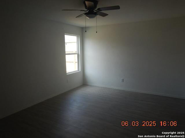 10751 Margarita Loop, Converse, TX 78109 - empty room featuring wood finished floors and a ceiling fan