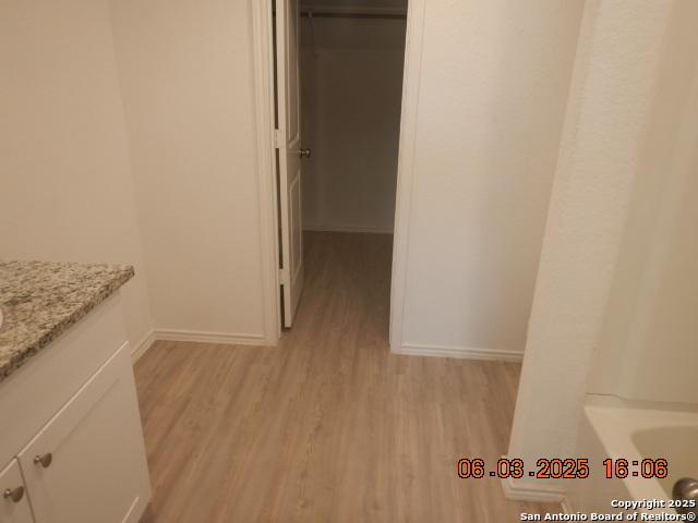 10751 Margarita Loop, Converse, TX 78109 - full bath with wood finished floors and vanity