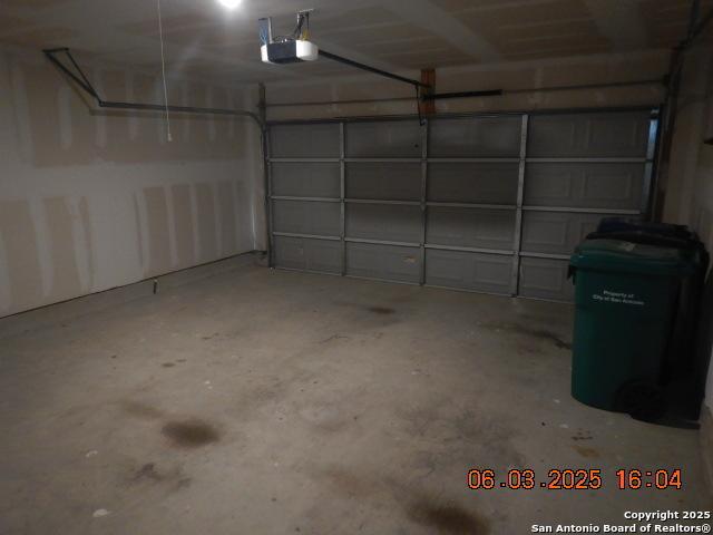 10751 Margarita Loop, Converse, TX 78109 - garage featuring a garage door opener