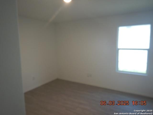 10751 Margarita Loop, Converse, TX 78109 - unfurnished room with wood finished floors