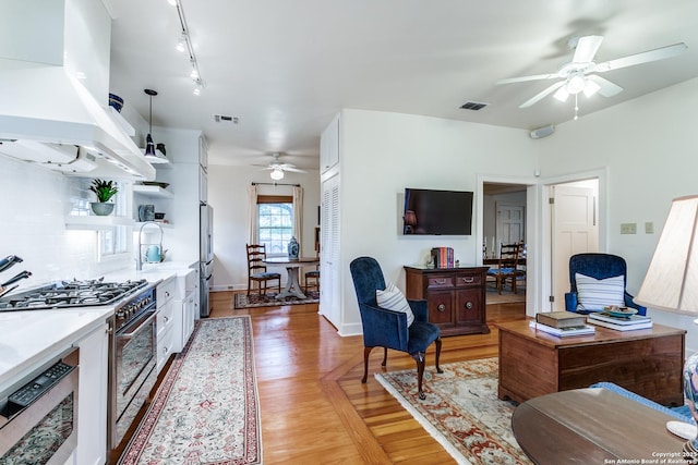 158 Laurel Hts, San Antonio, TX 78212 - office area with ceiling fan, track lighting, and light wood finished floors
