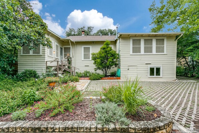 158 Laurel Hts, San Antonio, TX 78212 - back of property with a chimney and a patio