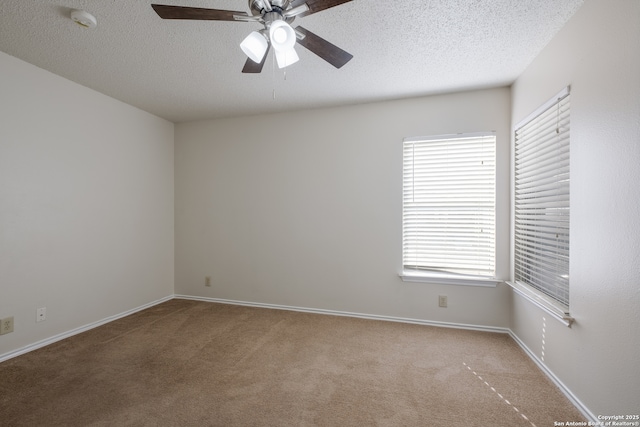 10217 Sandbrook, San Antonio, TX 78254 - spare room featuring carpet floors, a ceiling fan, a textured ceiling, and a smoke detector